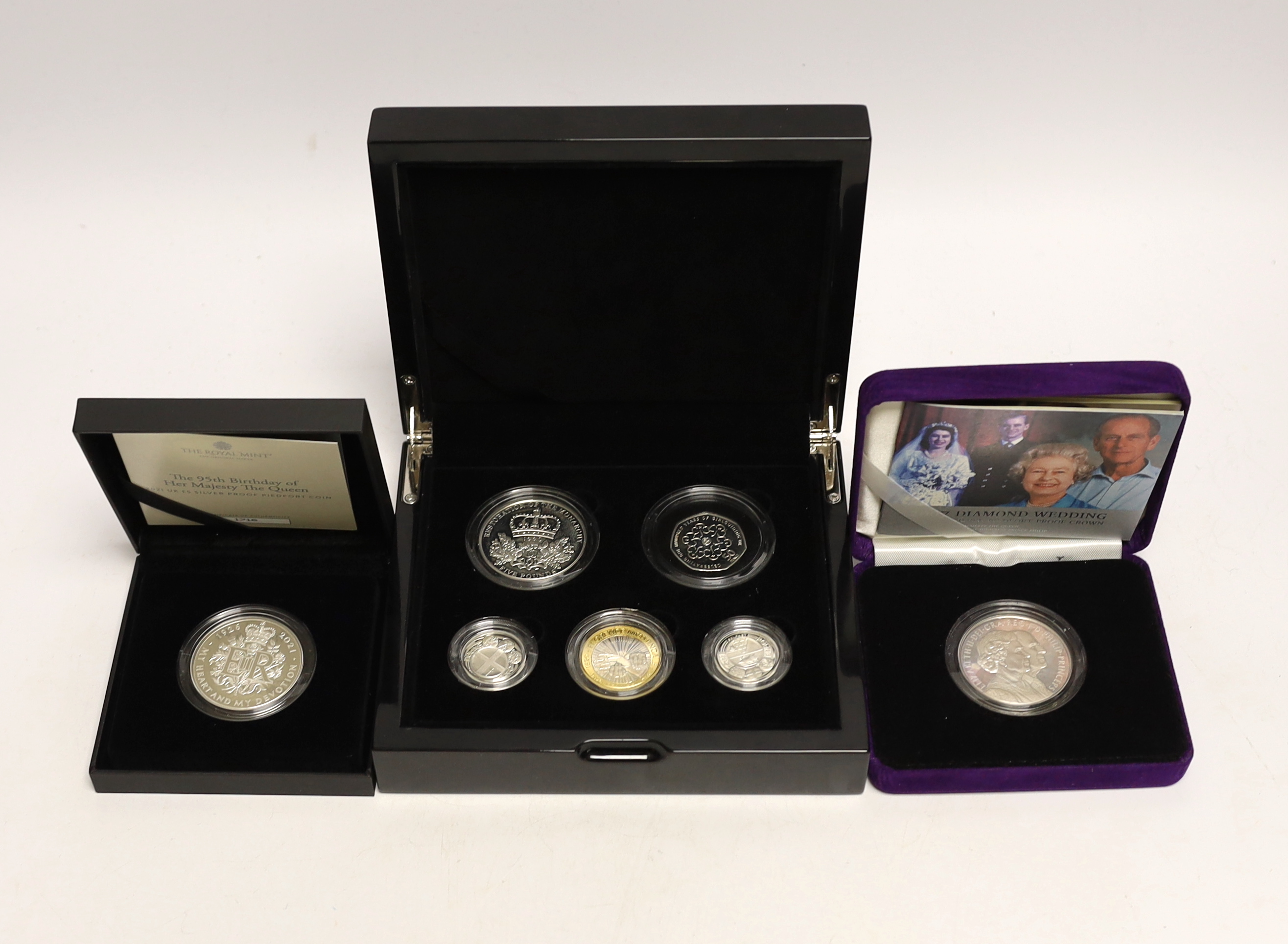 Royal Mint UK QEII silver piedfort proof coins - 2010 five coin set, 2021 95th birthday of her Majesty the Queen £5 and 2007 Diamond Wedding crown, 3 cases